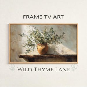 Puede incluir: Impresión artística enmarcada que presenta ramas de olivo en una maceta de terracota. La obra de arte se encuentra sobre un fondo neutro, con el texto "FRAME TV ART" y "WILD THYME LANE" mostrado arriba y abajo.