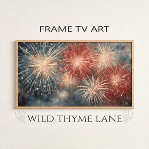 May include: A framed rectangular artwork featuring a vibrant depiction of fireworks. The artwork showcases bursts of red, white, and blue against a dark blue background. The text "FRAME TV ART" and "WILD THYME LANE" are printed on the image.