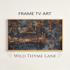 May include: A framed landscape painting of a cabin on a lake surrounded by trees. The artwork features a color palette of blues, oranges, and browns. The text "FRAME TV ART" and "WILD THYME LANE" are displayed on the image.