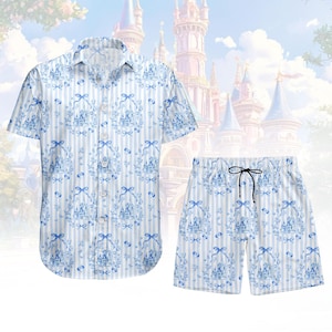 May include: A matching shirt and shorts set. The short-sleeved shirt and shorts are white with light blue stripes and a blue castle and bow pattern. The shorts have a drawstring.