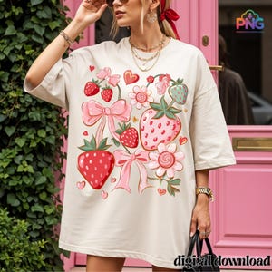 Adorable boho strawberry illustration featuring cute red and pink strawberries, delicate bows, flowers, and hearts in a soft coquette aesthetic. This hand-drawn PNG clipart with transparent background is perfect for digital projects, sublimation, scrapbooking, stickers, and girly decor. Its sweet and playful design adds a charming touch to planners, journals, or DIY crafts, making it a versatile and aesthetic choice for strawberry lovers.