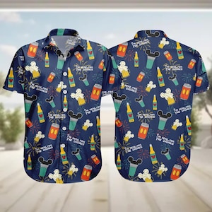 May include: Navy blue button-down shirt with a repeating pattern of cartoon drinks, popcorn, and fireworks. The text "I'M HERE FOR THE DRINKS" is scattered across the shirt. The shirt has short sleeves and a classic collar.