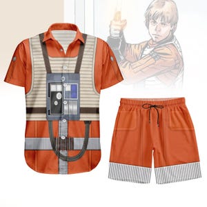 May include: Orange short-sleeved shirt and matching shorts set. The shirt features a detailed graphic design resembling a pilot's uniform, with a chest panel and straps. The shorts have pockets and a striped pattern at the hem. A comic illustration is in the background.