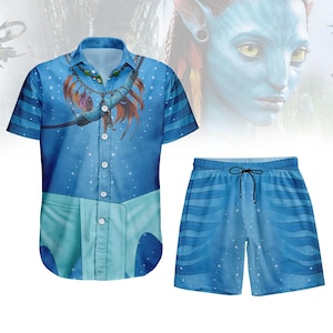 May include: A blue button-down shirt and matching shorts set. The shirt features a detailed graphic with a necklace and feathers. The shorts have a drawstring and a blue wave pattern. The set is decorated with white dots.