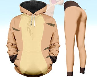 Pode incluir: Um conjunto de moletom com capuz e leggings bege, com um design de personagem de desenho animado. O moletom tem um capuz forrado de preto e um bolso canguru. As leggings são bege com detalhes pretos nos tornozelos.