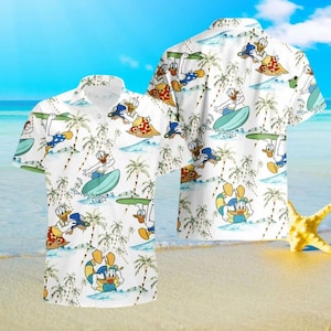 May include: White short-sleeved button-down shirt with a repeating pattern of a cartoon duck surfing on a wave with palm trees in the background.