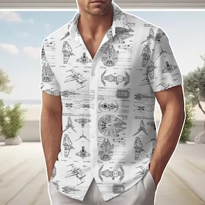 May include: White short-sleeved shirt with a black line drawing pattern of starships. The shirt has a classic collar and a relaxed fit. The design includes detailed schematics of iconic spacecraft.