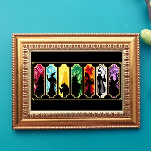 May include: A framed cross-stitch design featuring a row of eight colorful stained glass windows with silhouettes of figures inside each window.