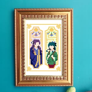 May include: A framed cross-stitch embroidery featuring two pixelated figures in traditional clothing. The figures are standing in ornate golden frames with floral designs. The background is white.