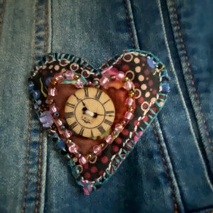 Handstitched fabric heart shaped pin with wooden button