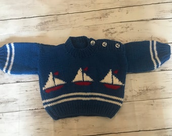 Hand Knitted Baby Jumper with Little Boat Detail.