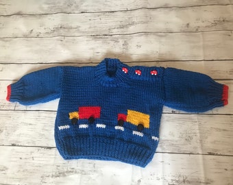 Hand Knitted Baby Jumper. Royal Blue with Red and Yellow Truck detail. Machine Washable.