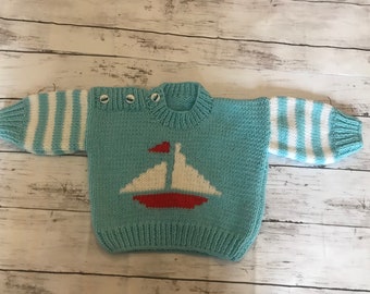 Maglione per bebè lavorato a mano con tema barca nautica
