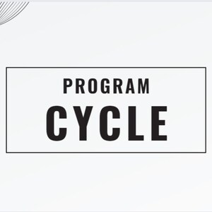 May include: A white background with black text that reads "PROGRAM CYCLE" in a rectangular box. The text is in a bold, sans-serif font. There are black wavy lines in the top left and bottom right corners of the image. The text "SHANABANADING DONG" is in the top right corner of the image.