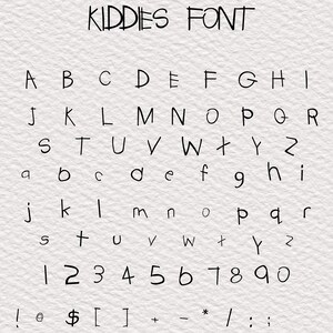 May include: A handwritten font alphabet in black ink on a white textured background. The font is called "Kiddies Font" and includes uppercase and lowercase letters, numbers, and punctuation marks.