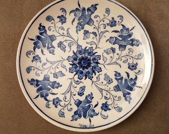 Traditional Iznic çini/ceramic painting pattern finds life on 18cm plate in blue ink.