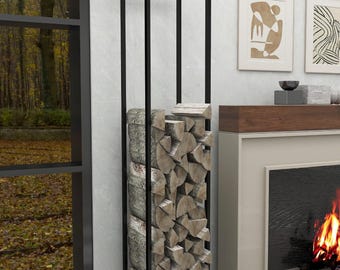 May include: Black metal firewood rack with stacked logs inside. The rack is standing on a light gray rug in front of a fireplace.