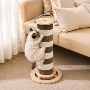 May include: A cat scratching post with a light brown and white striped pattern. The post features a round base and top, with a blue handle. A fluffy cat is climbing the post, using it to scratch its claws.