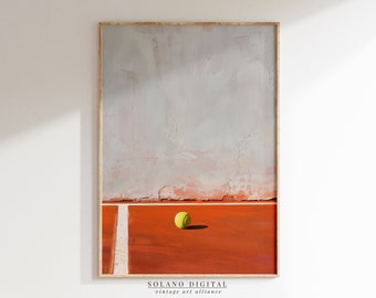 May include: A framed painting of a tennis court with a single yellow tennis ball in the center. The court is red clay and the background is a gray wall.