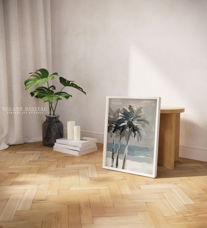 Printable wall art featuring abstract brushstrokes of palm trees with an ocean backdrop, available for digital download on Etsy. Ideal for adding a serene coastal vibe to any room, perfect for beach lovers and modern art enthusiasts.