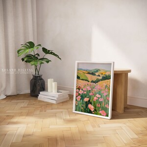 Vibrant floral landscape wall art printable featuring blooming pink flowers against rolling green hills. Perfect for adding a touch of nature and color to any space. Available on Etsy for easy download and print.