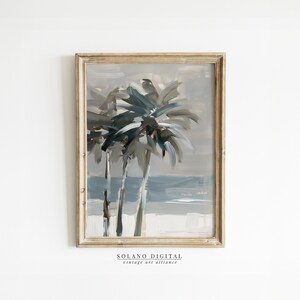 Printable wall art featuring abstract brushstrokes of palm trees with an ocean backdrop, available for digital download on Etsy. Ideal for adding a serene coastal vibe to any room, perfect for beach lovers and modern art enthusiasts.