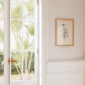 Beige minimalist art print featuring abstract female form; downloadable wall art available on Etsy; perfect for nursery or guest room.