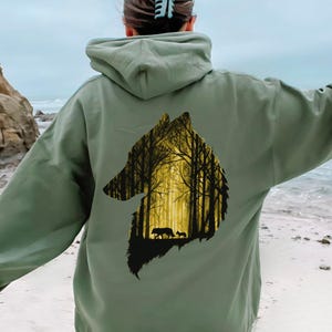 Forest Wolf Hoodie, Woodland Wolf Graphic Pullover for Nature Lovers and Forestcore Aesthetic Style Military Green