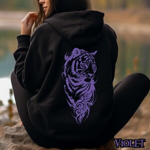 May include: A black hoodie with a purple tiger design on the back. The tiger is facing to the right and has a floral design around it.
