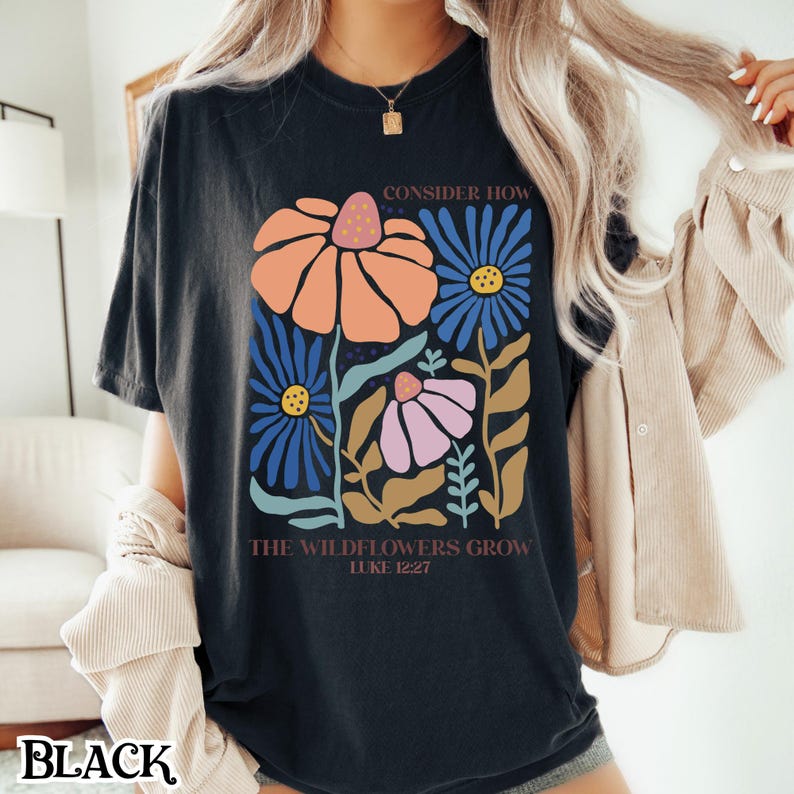 May include: Black t-shirt with a floral design and the text "Consider how the wildflowers grow Luke 12:27".