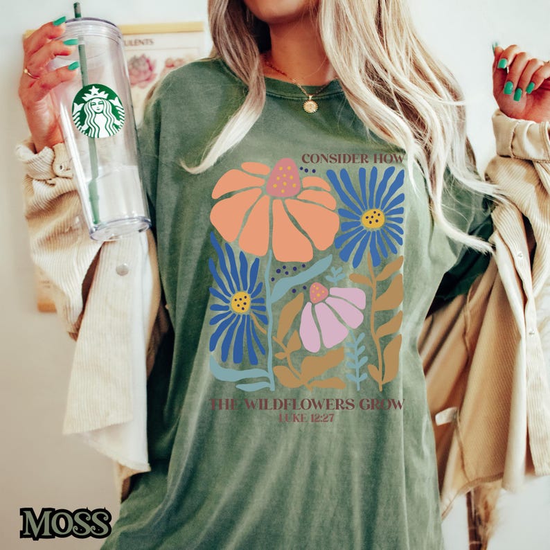 May include: A green t-shirt with a floral design and the text "Consider how the wildflowers grow Luke 12:27".