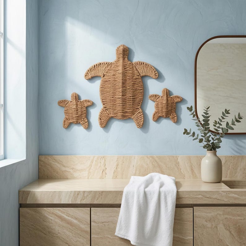 a bathroom with a blue wall, a wooden turtle decoration, a towel, and a vase with greenery.