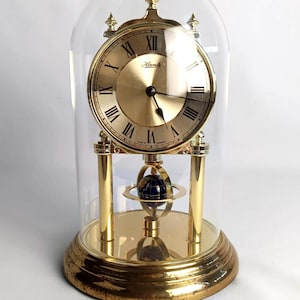 Hermle torsion pendulum clock with glass dome and globe pendulum | Brass table clock, mantel clock, made in Germany | Skeleton clock, anniversary clock, Hollywood Regency pendulum clock