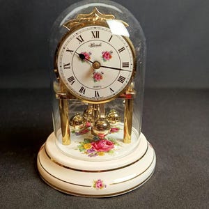 Hermle Porcelain Pendulum Clock With Glass Dome and Floral