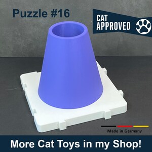May include: A blue cone-shaped cat toy sits atop a white square base. The text "Puzzle #16" is at the top left, and "CAT APPROVED" is on the right. The bottom of the image reads "More Cat Toys in my Shop!"