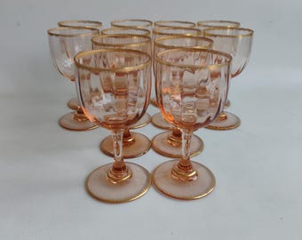 12 Daum crystal glasses, gold rim, early 20th century.