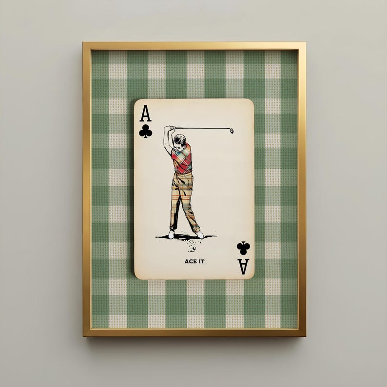 Vintage golf art print featuring an ace of clubs playing card with a classic golfer in mid-swing against a green gingham background. Displayed in a slim gold hardwood frame, this preppy country club wall art adds timeless character to offices, studies, clubhouses, libraries, and masculine interiors.