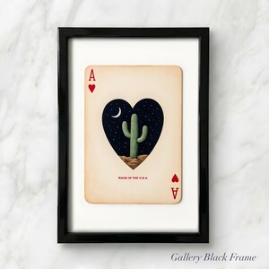 May include: Framed Ace of Hearts playing card art. The card features a heart-shaped design with a cactus under a crescent moon and starry night sky. The text "MADE IN THE U.S.A." is printed at the bottom.
