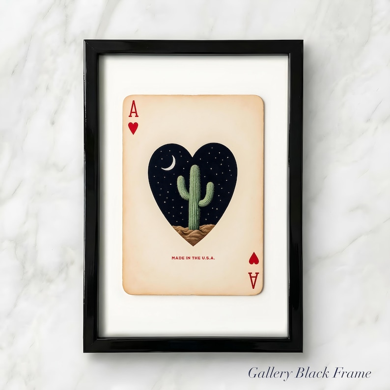 May include: Framed Ace of Hearts playing card art. The card features a heart-shaped design with a cactus under a crescent moon and starry night sky. The text "MADE IN THE U.S.A." is printed at the bottom.