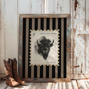 Charcoal sketch of a bison styled as a vintage postage stamp on a black and tan striped background; rustic Western art print.