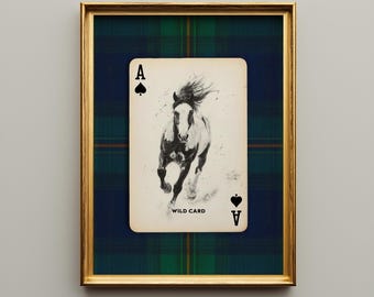 May include: Framed art print featuring a playing card with a running horse illustration. The card is the Ace of Spades, labeled "WILD CARD." The background is a blue and green plaid pattern, framed in gold.