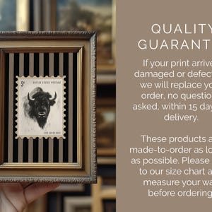 May include: Framed vintage postage stamp art featuring a black and white bison image. The stamp is set against a black and gray striped background within a gold-toned frame. The artwork is a unique piece of wall decor.