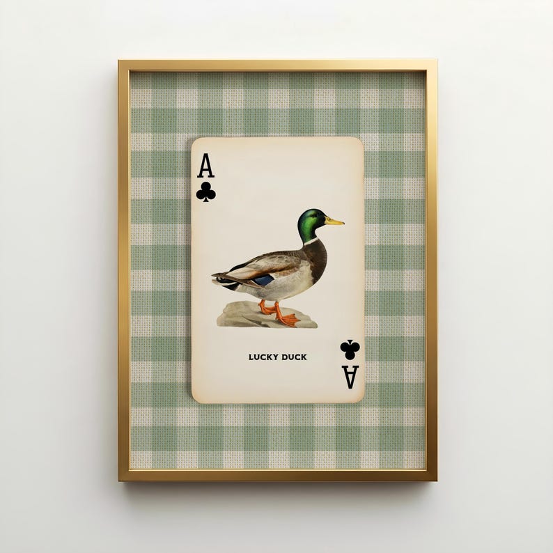 A vintage inspired Ace of Clubs playing card design with a botanical illustration of a mallard duck and the words "Lucky Duck" at the bottom of the card. Set against a green and oatmeal colored gingham patterned linen texture. Farmhouse decor.