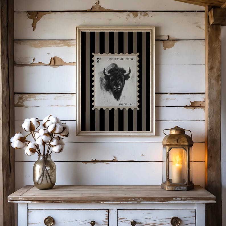 Charcoal sketch of a bison styled as a vintage postage stamp on a black and tan striped background; rustic Western art print.