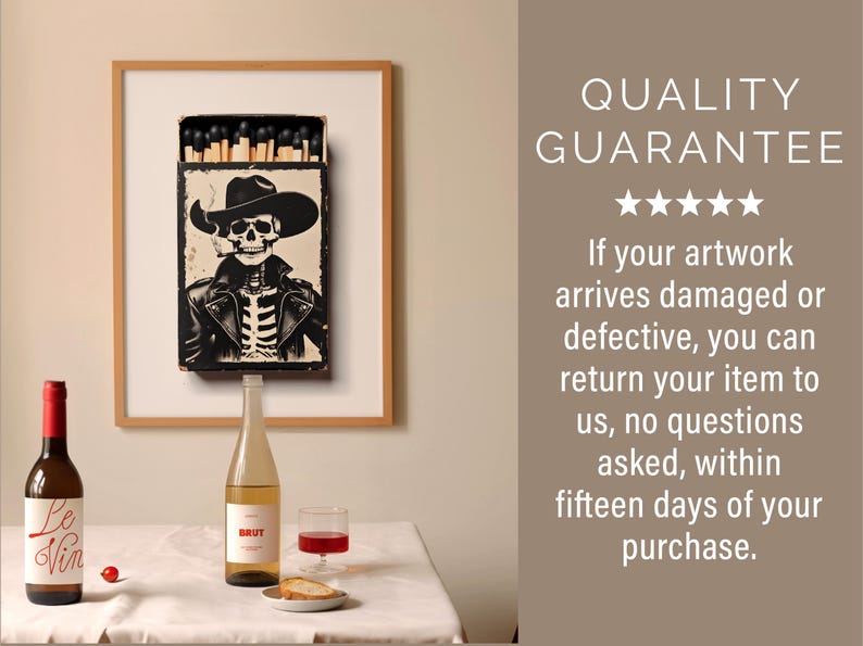 May include: A framed print of a matchbox with a skeleton cowboy wearing a hat and smoking a cigarette. The print is hanging on a wall above a table with two bottles of wine and a glass of wine.