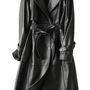 May include: A long black leather trench coat with a belt and a double-breasted closure.