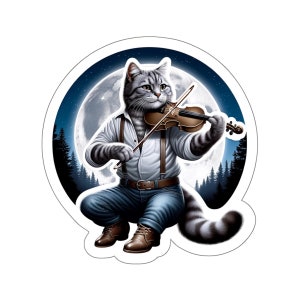 May include: A grey and white cat wearing a white shirt, blue jeans and braces plays a violin under a full moon. The cat is sitting on a forest floor with trees in the background.