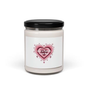 May include: A white ceramic mug with a black handle and the text "But First, Coffee" in a bold, black font. The mug is filled with a dark liquid, probably coffee, and rests on a light-coloured surface.
