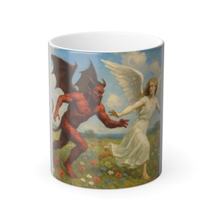 May include: White ceramic mug featuring a vintage painting of a red devil chasing a white-robed angel across a field of flowers under a blue sky. The mug has a glossy finish and a standard handle.