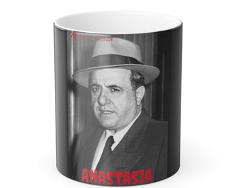 May include: Black and white mug with a photo of a man in a hat. The text "ANASTASIA" is printed in red at the bottom of the mug.